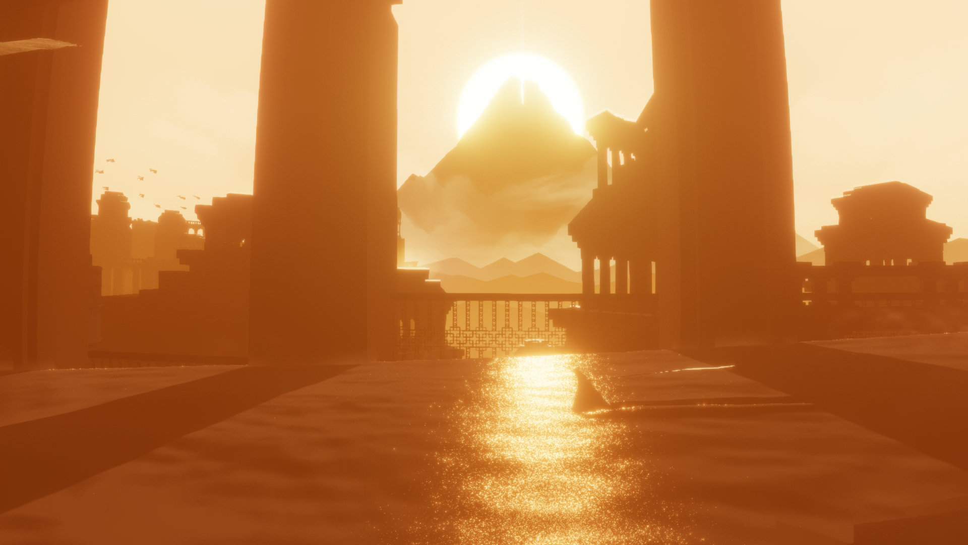 A robed figure in a vast desert landscape with ancient pillars and a glowing mountain in the distance in Journey